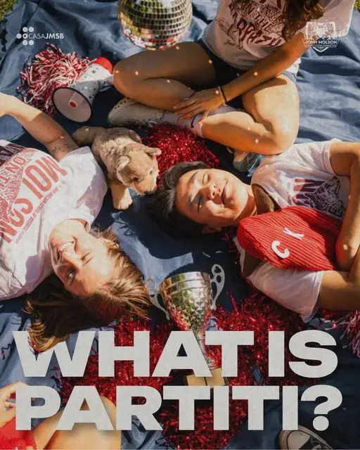 JMCC delegates in “Molson on the Warpath” tees lie on a blanket among red pom-poms, a megaphone, a disco ball, a stuffed wolf and a silver trophy. What Is Partiti?